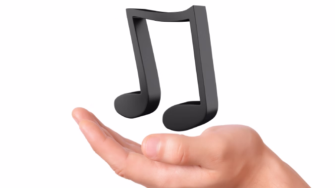 Mano sosteniendo una nota musical representando el concepto de la música